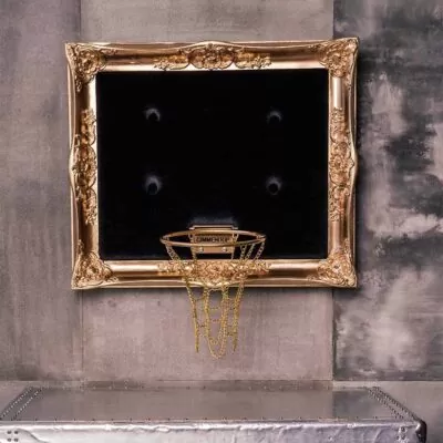 Gold framed hoop with black velvet and a gold chain net